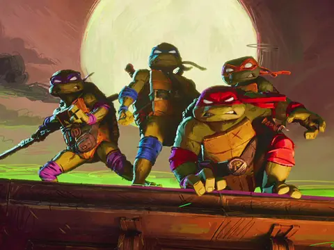 The turtles, Raph, Mikey, Leo and Donnie, pose on a New York City roof-top ready to take action. Teenage Mutant Ninja Turtles: Mutant Mayhem premieres later this summer.